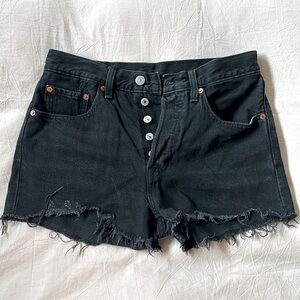 Black denim, cutoff shorts. Levi’s 501